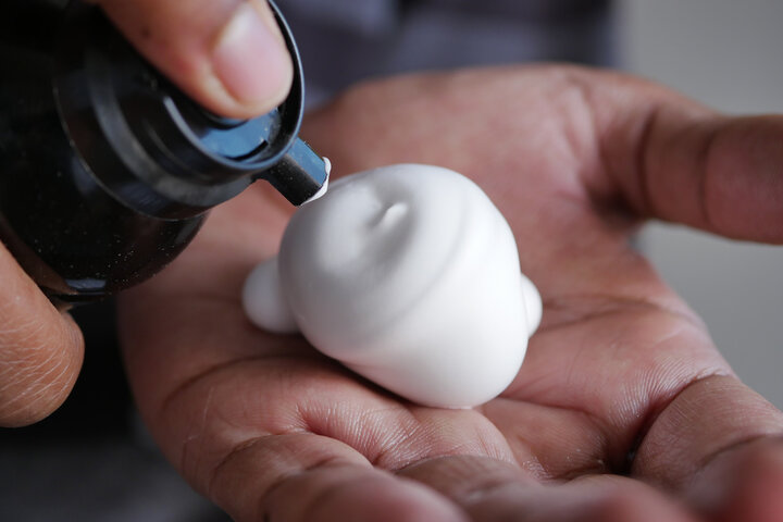 top view of shaving foam on hand